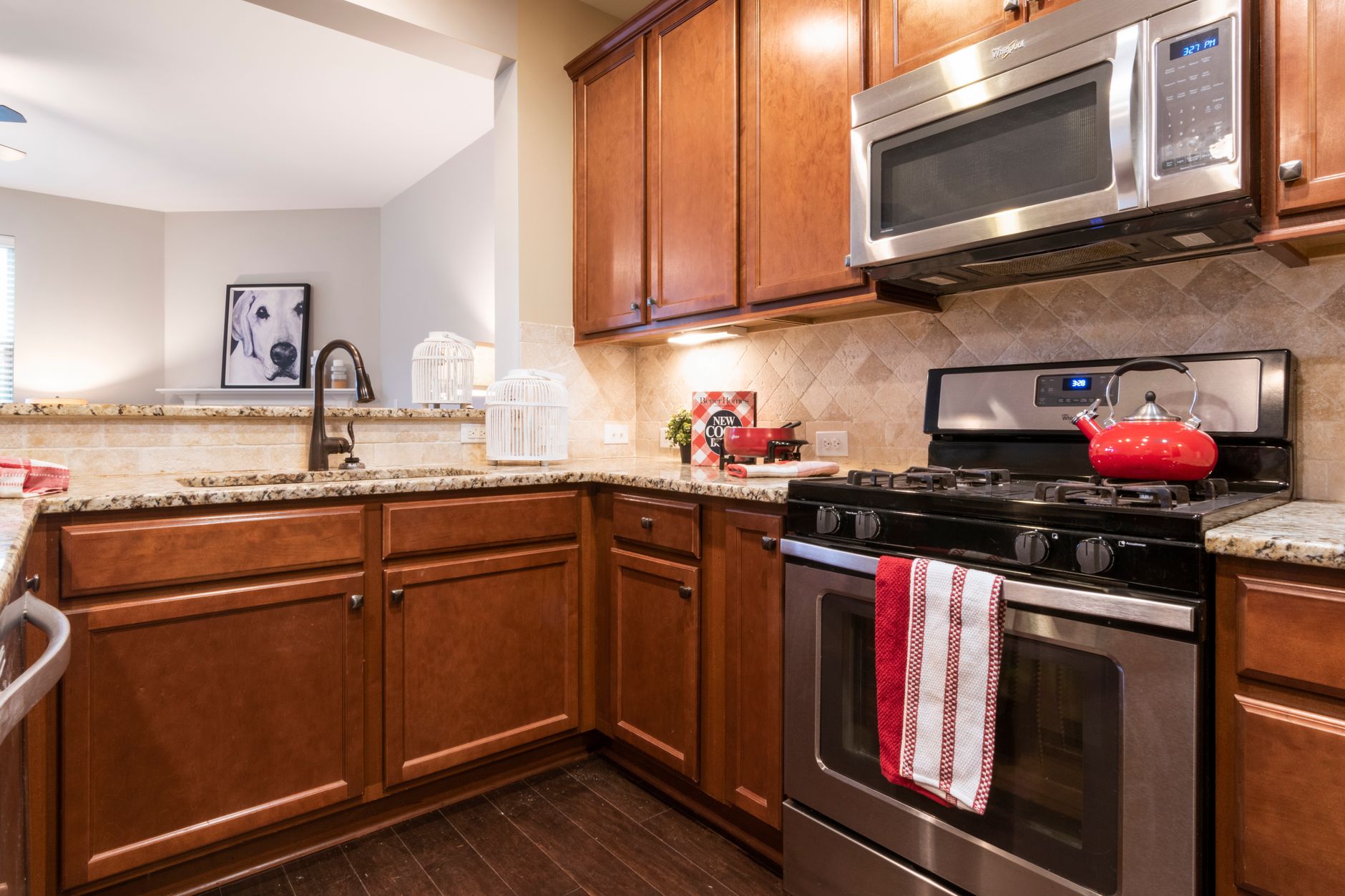 Cozy kitchen featuring wooden cabinets and granite countertops